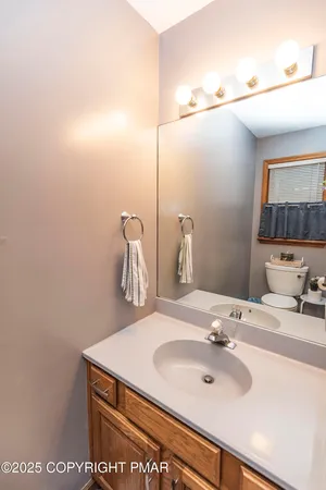 a bedroom with a bed a desk and chair