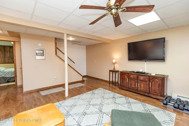 an aerial view of a house with yard swimming pool and outdoor seating
