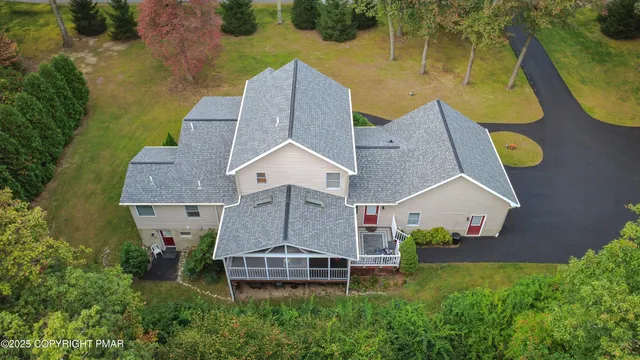 a dining room with a table and chairs