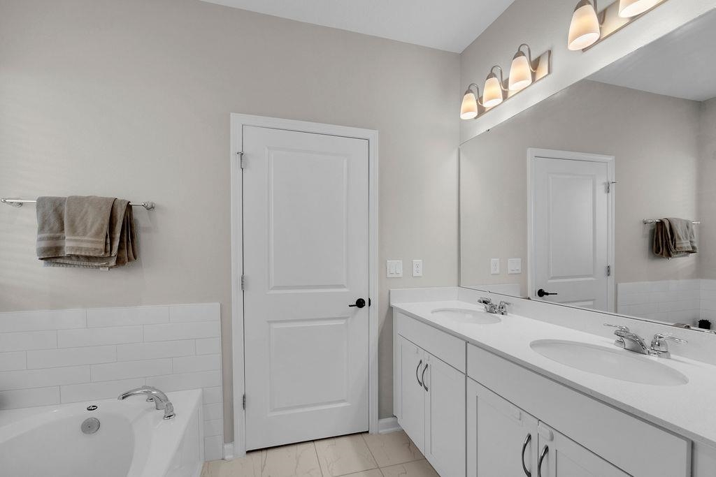 161 Goldcrest Way St. Augustine, FL 32092 - Photo 18 of 52 a bathroom with a sink and a mirror