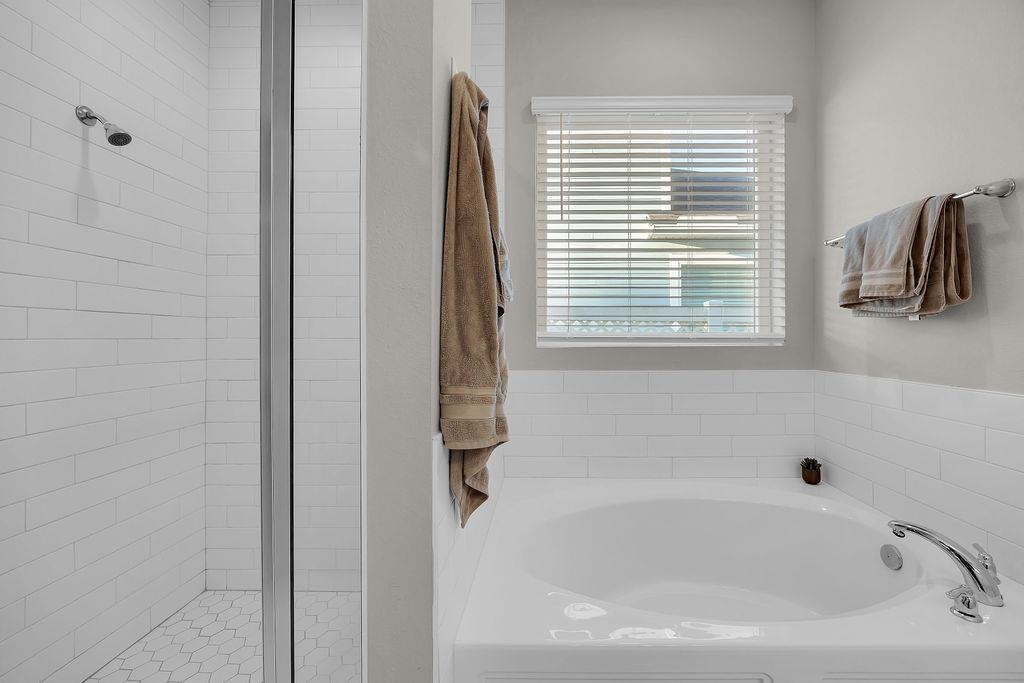 161 Goldcrest Way St. Augustine, FL 32092 - Photo 17 of 52 a white bath tub sitting next to a window