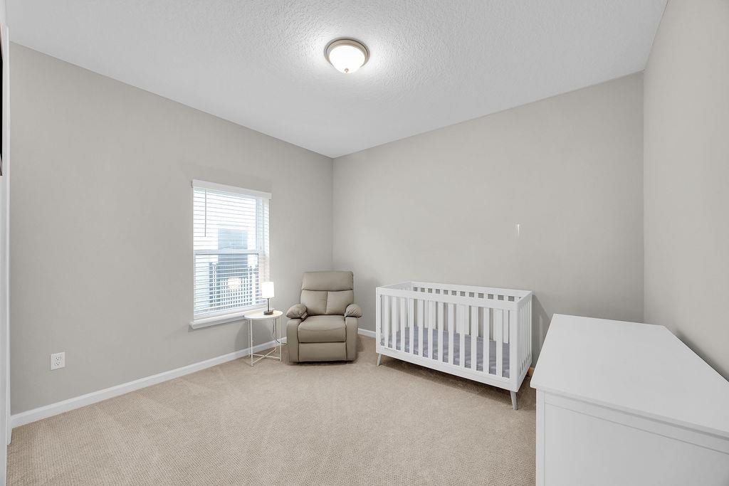 161 Goldcrest Way St. Augustine, FL 32092 - Photo 22 of 52 a living room with furniture and a window