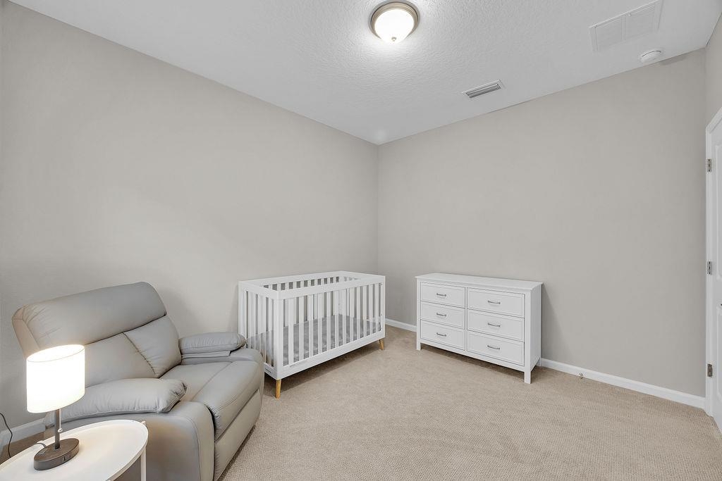 161 Goldcrest Way St. Augustine, FL 32092 - Photo 23 of 52 a room with furniture and a window