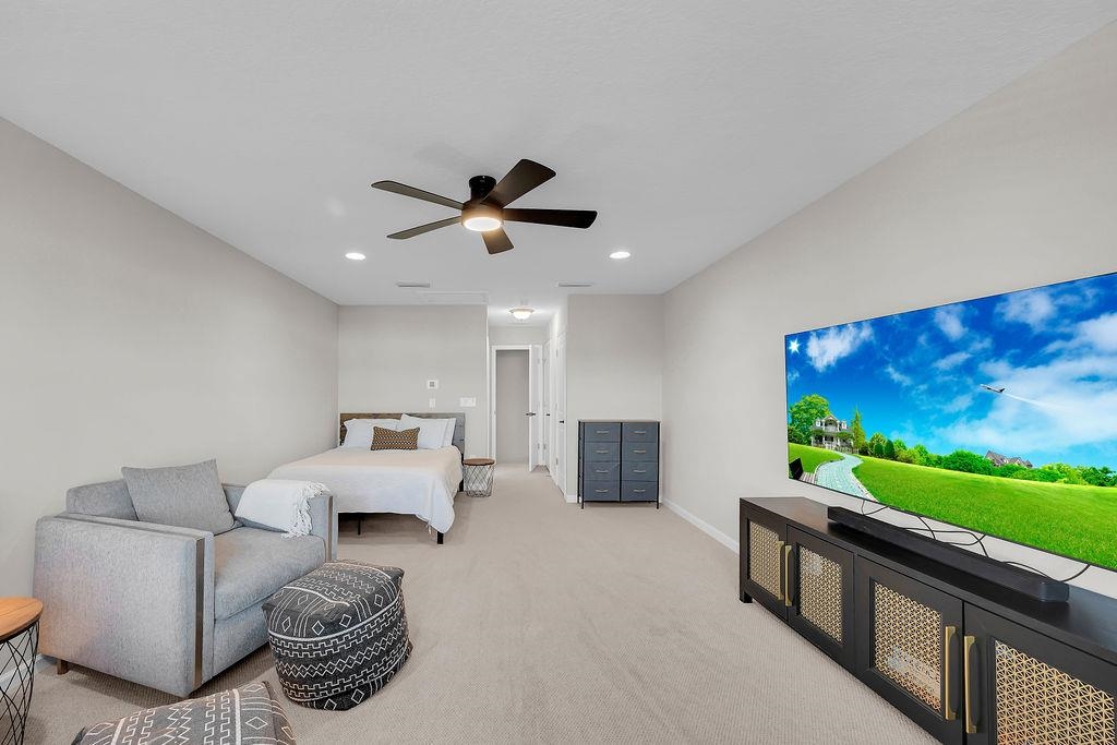 161 Goldcrest Way St. Augustine, FL 32092 - Photo 24 of 52 a living room with furniture and a flat screen tv