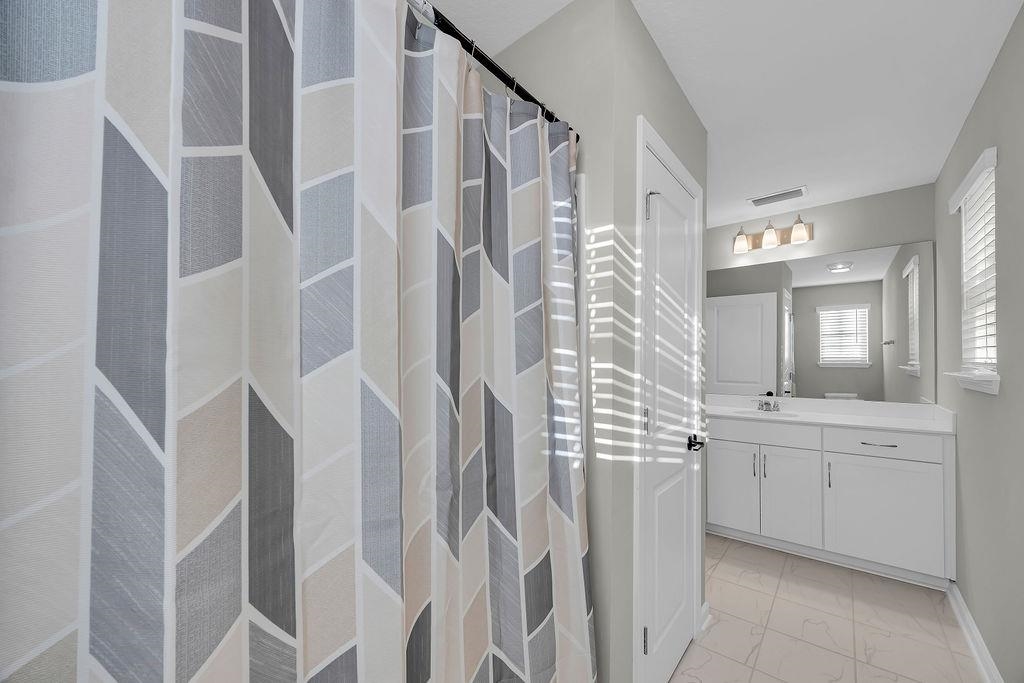 161 Goldcrest Way St. Augustine, FL 32092 - Photo 29 of 52 a spacious bathroom with a shower and a sink