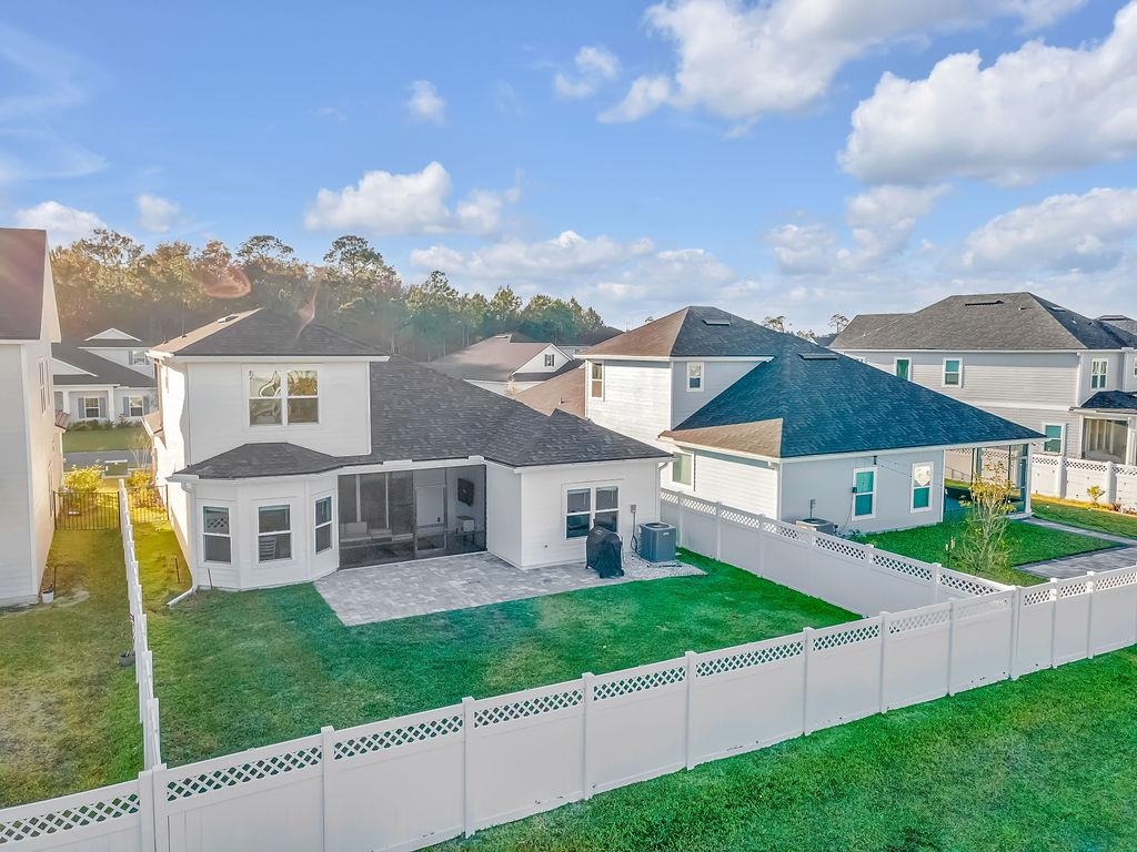 161 Goldcrest Way St. Augustine, FL 32092 - Photo 42 of 52 a view of house with a big yard and potted plants