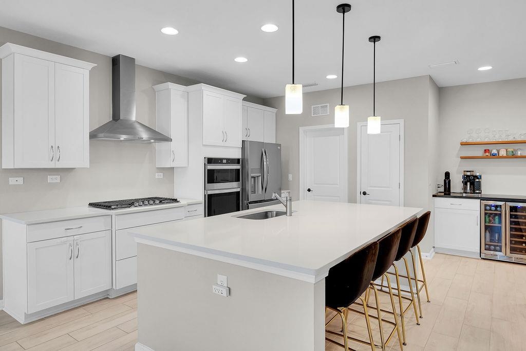 161 Goldcrest Way St. Augustine, FL 32092 - Photo 8 of 52 a kitchen that has a lot of cabinets in it and appliances