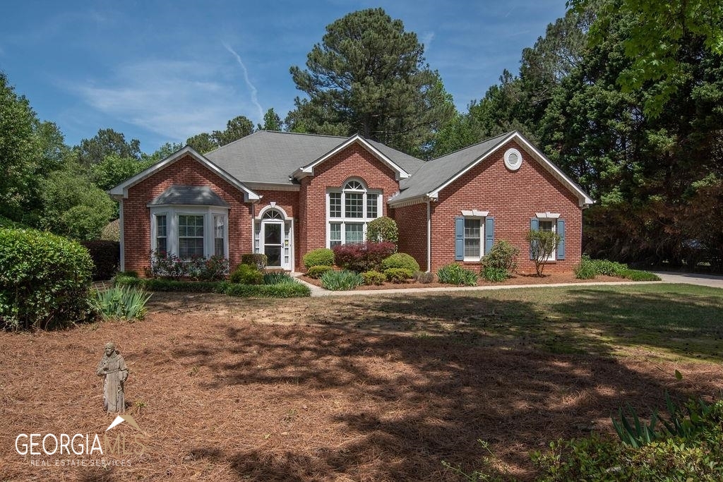 97 Red Maple Drive Hampton, GA 30228 - Photo 1 of 1 a front view of a house with a yard