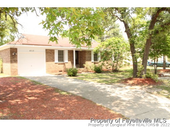 4513 Ruby Road Fayetteville, NC 28311 - Photo 2 of 10 a view of a yard with a house in the background