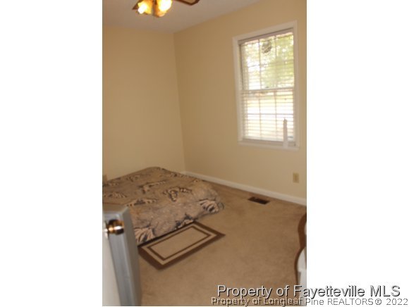 4513 Ruby Road Fayetteville, NC 28311 - Photo 10 of 10 a picture of a room with a floor to ceiling window