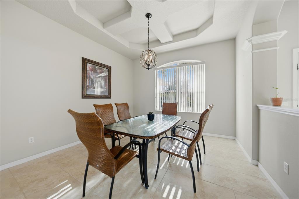5455 Graves Terrace Port Charlotte, FL 33981 - Photo 11 of 54 a view of a dining room with furniture and a chandelier