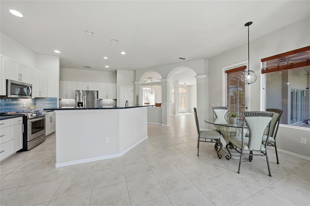 5455 Graves Terrace Port Charlotte, FL 33981 - Photo 16 of 54 a large kitchen with a table and chairs