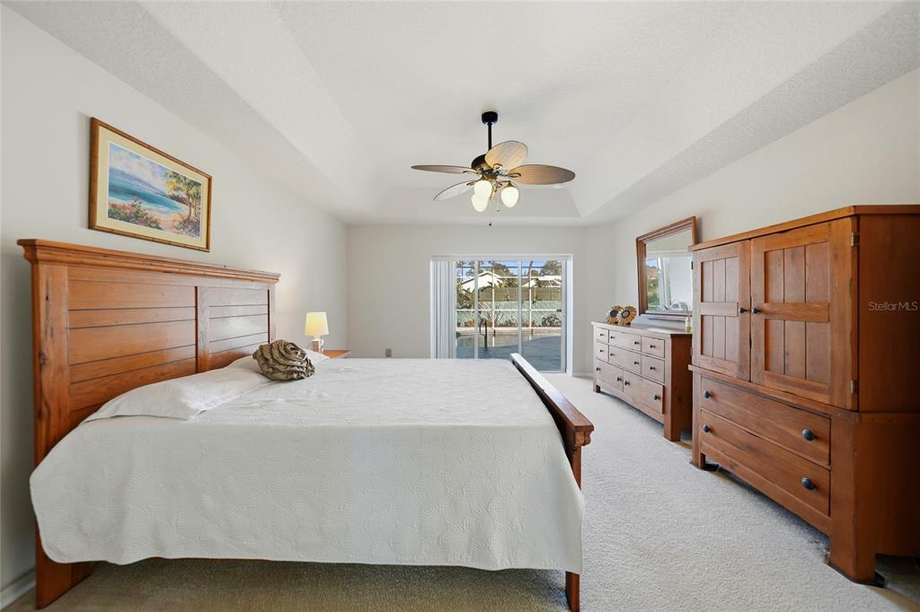 5455 Graves Terrace Port Charlotte, FL 33981 - Photo 20 of 54 a bedroom with a bed and a refrigerator