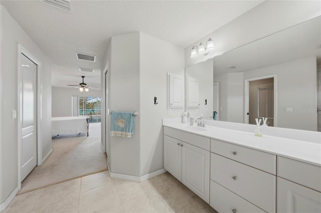 5455 Graves Terrace Port Charlotte, FL 33981 - Photo 25 of 54 a spacious bathroom with a double vanity sink mirror and toilet