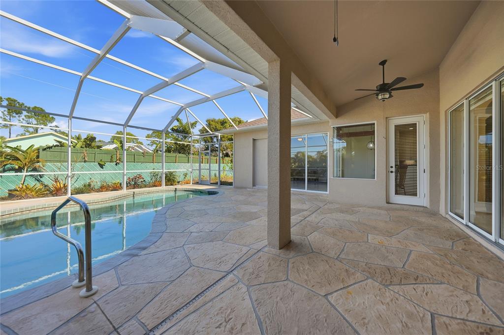 5455 Graves Terrace Port Charlotte, FL 33981 - Photo 43 of 54 a view of porch with a table and chairs under an umbrella