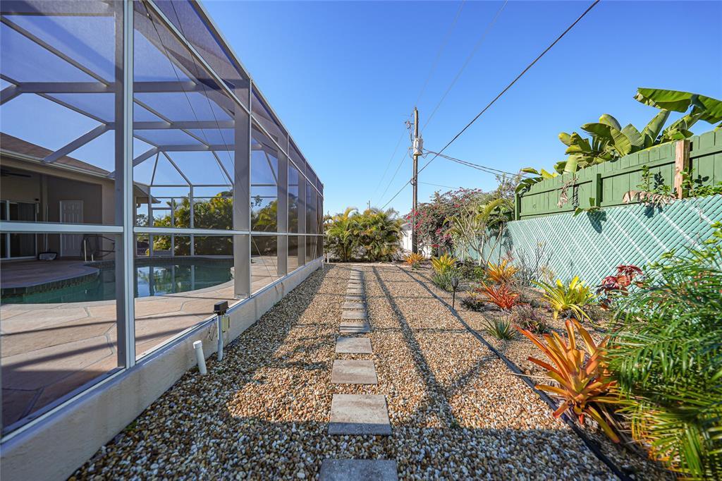 5455 Graves Terrace Port Charlotte, FL 33981 - Photo 46 of 54 a view of a pathway both side of the house