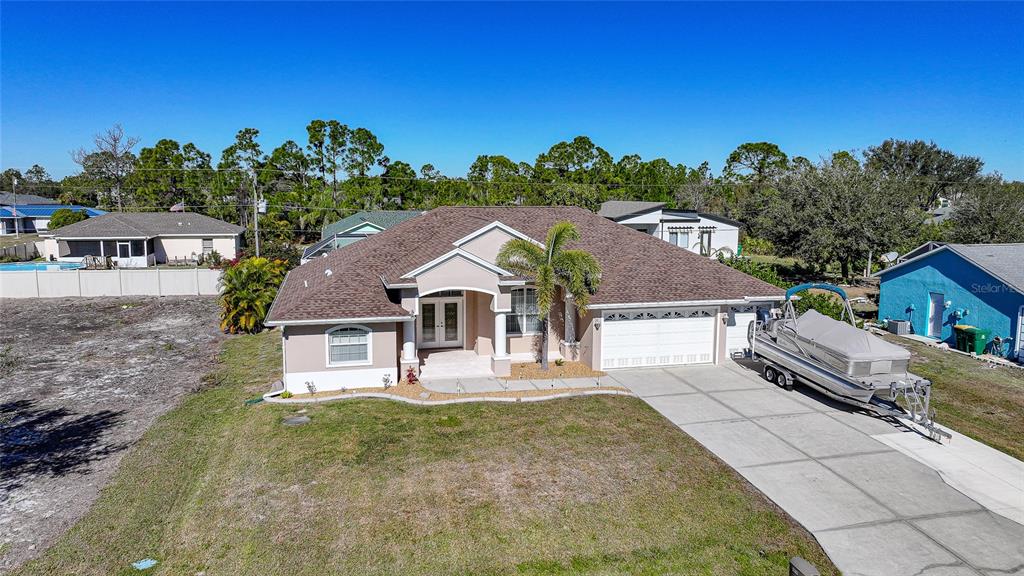 5455 Graves Terrace Port Charlotte, FL 33981 - Photo 49 of 54 front view of a house with a yard