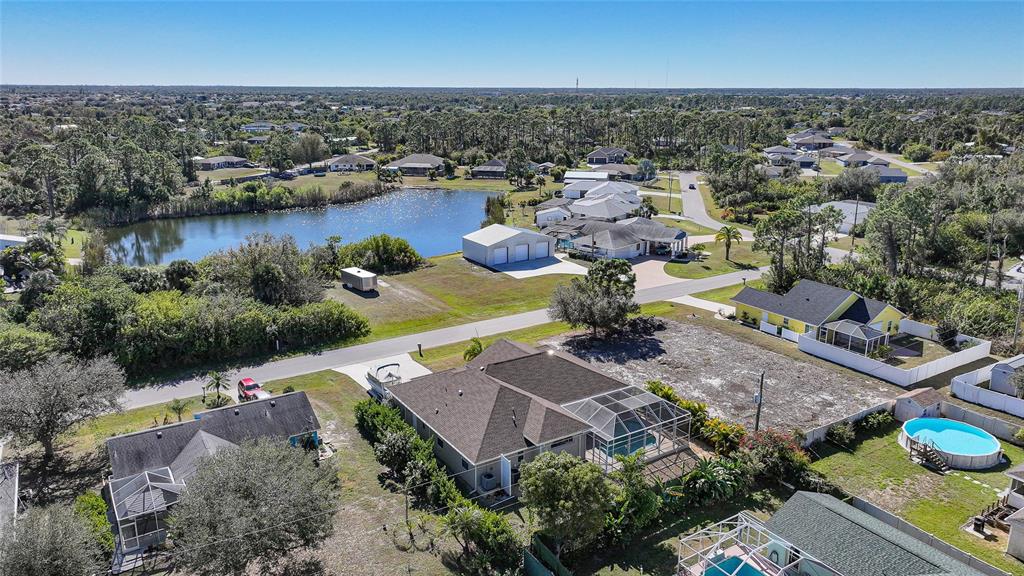 5455 Graves Terrace Port Charlotte, FL 33981 - Photo 51 of 54 an aerial view of a house with a garden and lake view