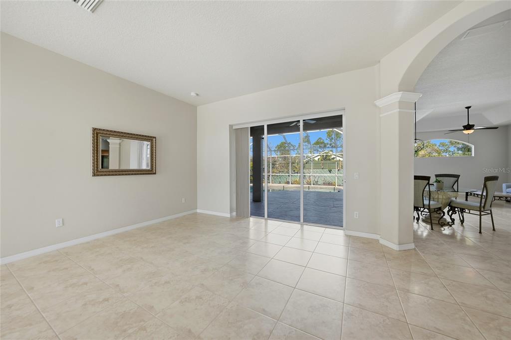 5455 Graves Terrace Port Charlotte, FL 33981 - Photo 6 of 54 a view of an empty room with glass door