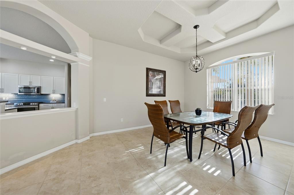 5455 Graves Terrace Port Charlotte, FL 33981 - Photo 9 of 54 a view of a dining room with furniture and wooden floor