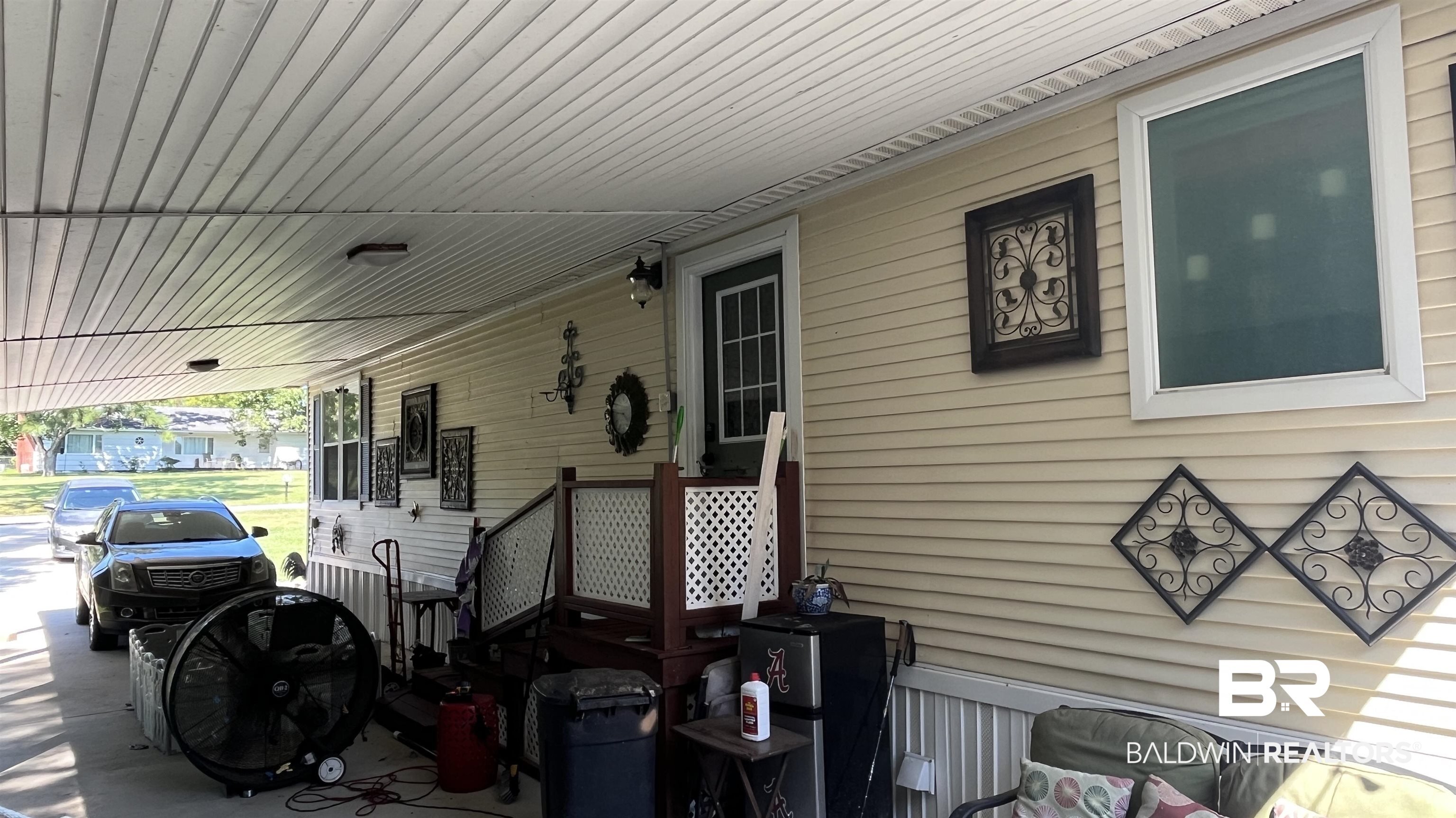 12932 Santa Piedro Street Lillian, AL 36549 - Photo 19 of 20 Covered porch with an attached carport