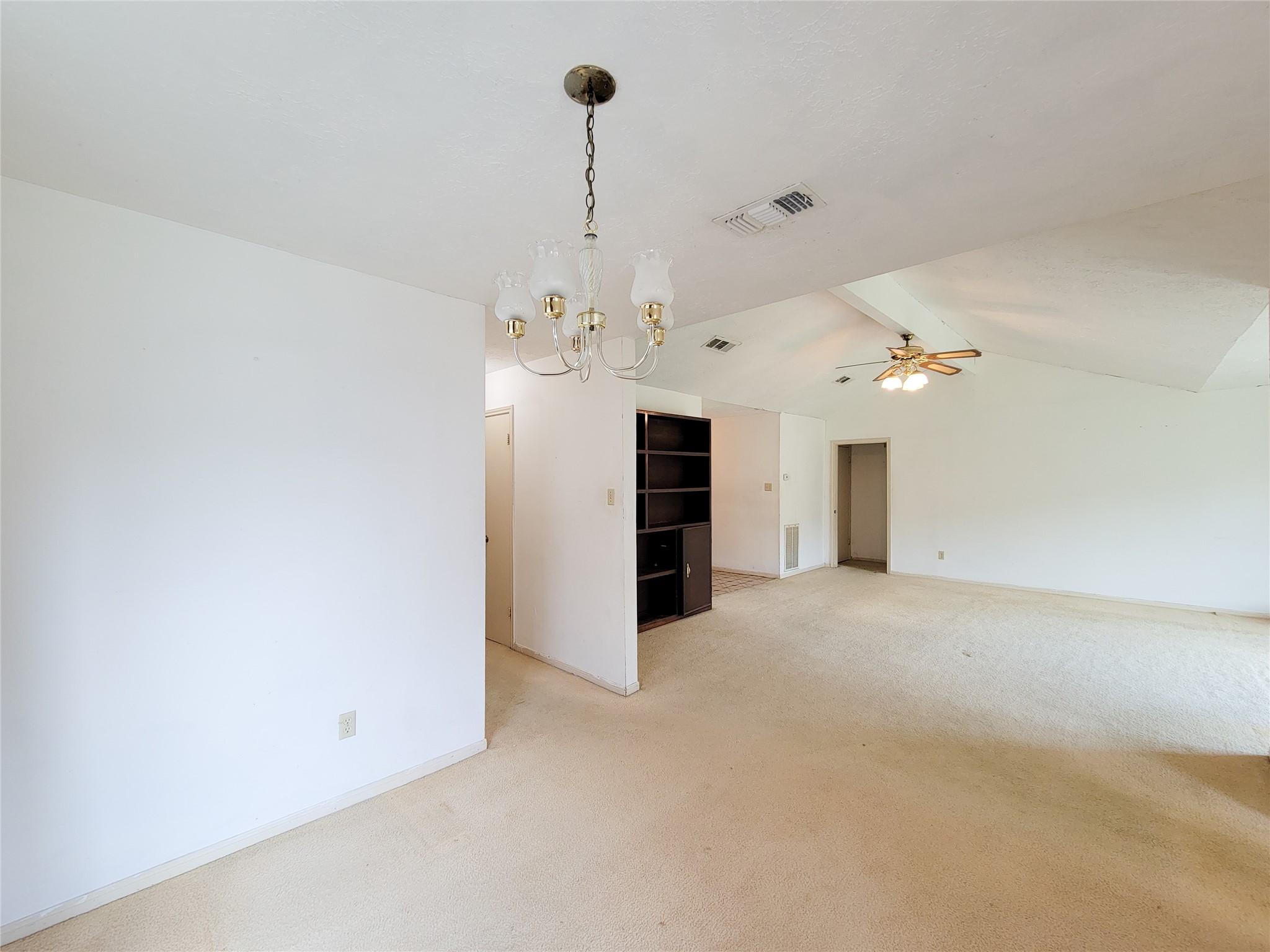 23211 Timberbrook Drive Spring, TX 77373 - Photo 14 of 34 a view of a kitchen with a sink and a chandelier fan