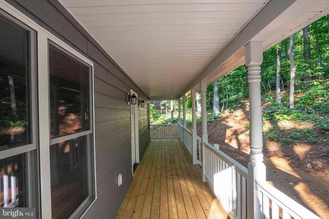 a view of a kitchen with an empty space and a window