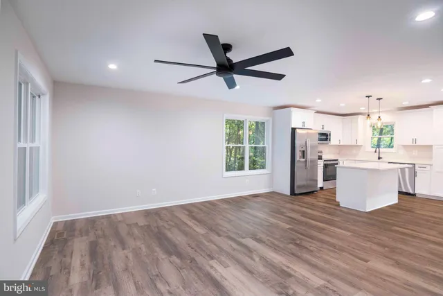a view of balcony with deck and trees
