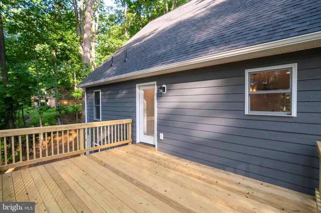 a bedroom with a bed a couch and a window