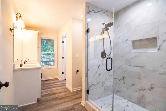 a bathroom with a sink and a window