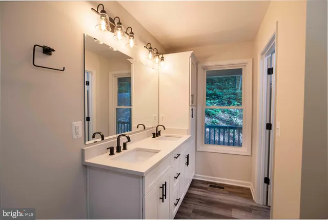 a bedroom with a bed couch and a window