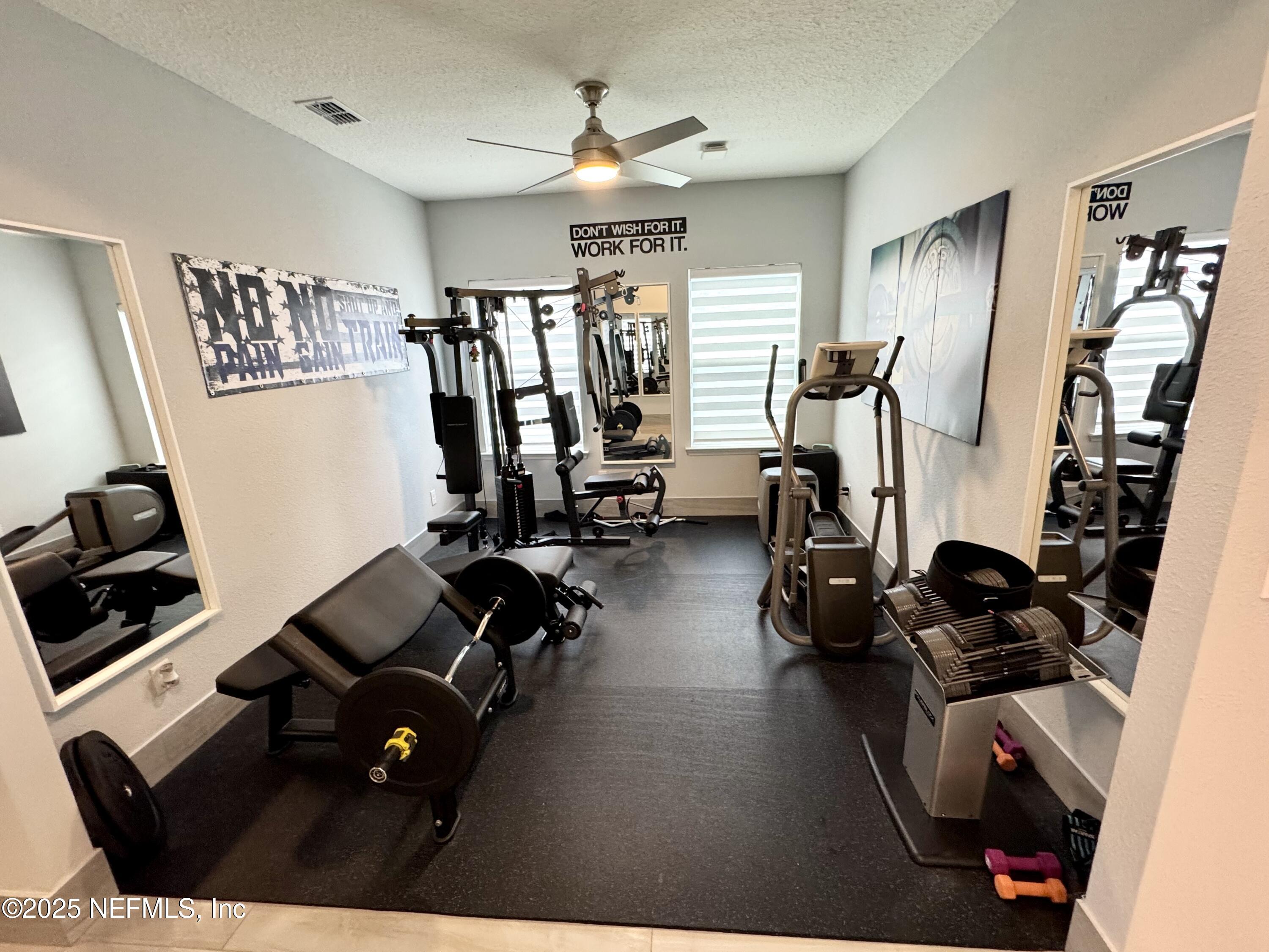 163 Pine Forest Court St. Augustine, FL 32092 - Photo 18 of 85 a view of a room with gym equipment