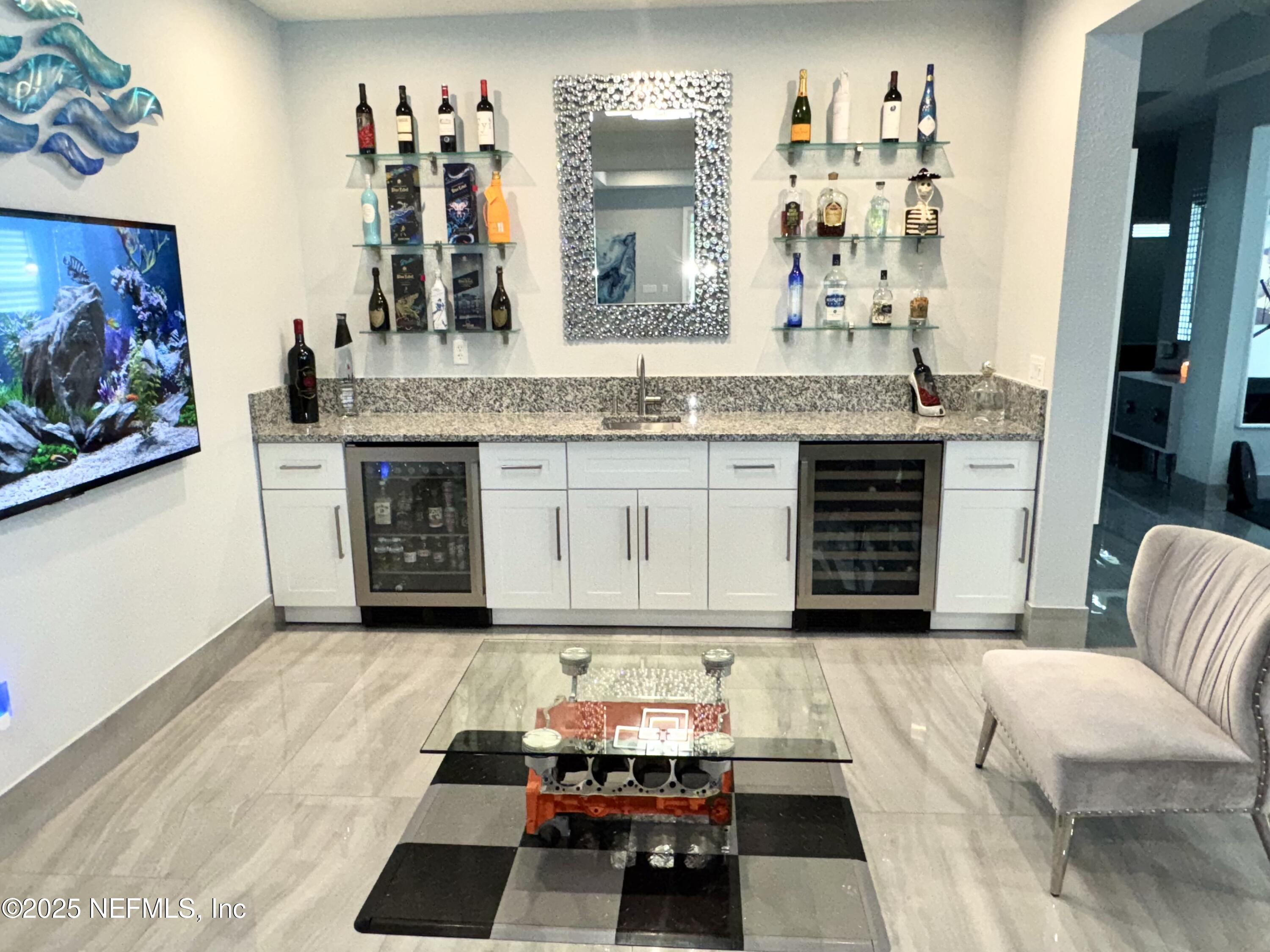 163 Pine Forest Court St. Augustine, FL 32092 - Photo 25 of 85 a living room with furniture and a wooden floor