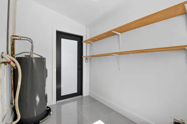 a view of a storage & utility room with washer and dryer