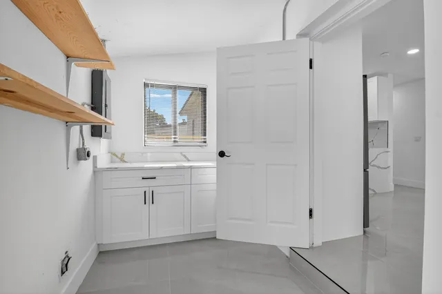 a bathroom with a sink vanity and mirror
