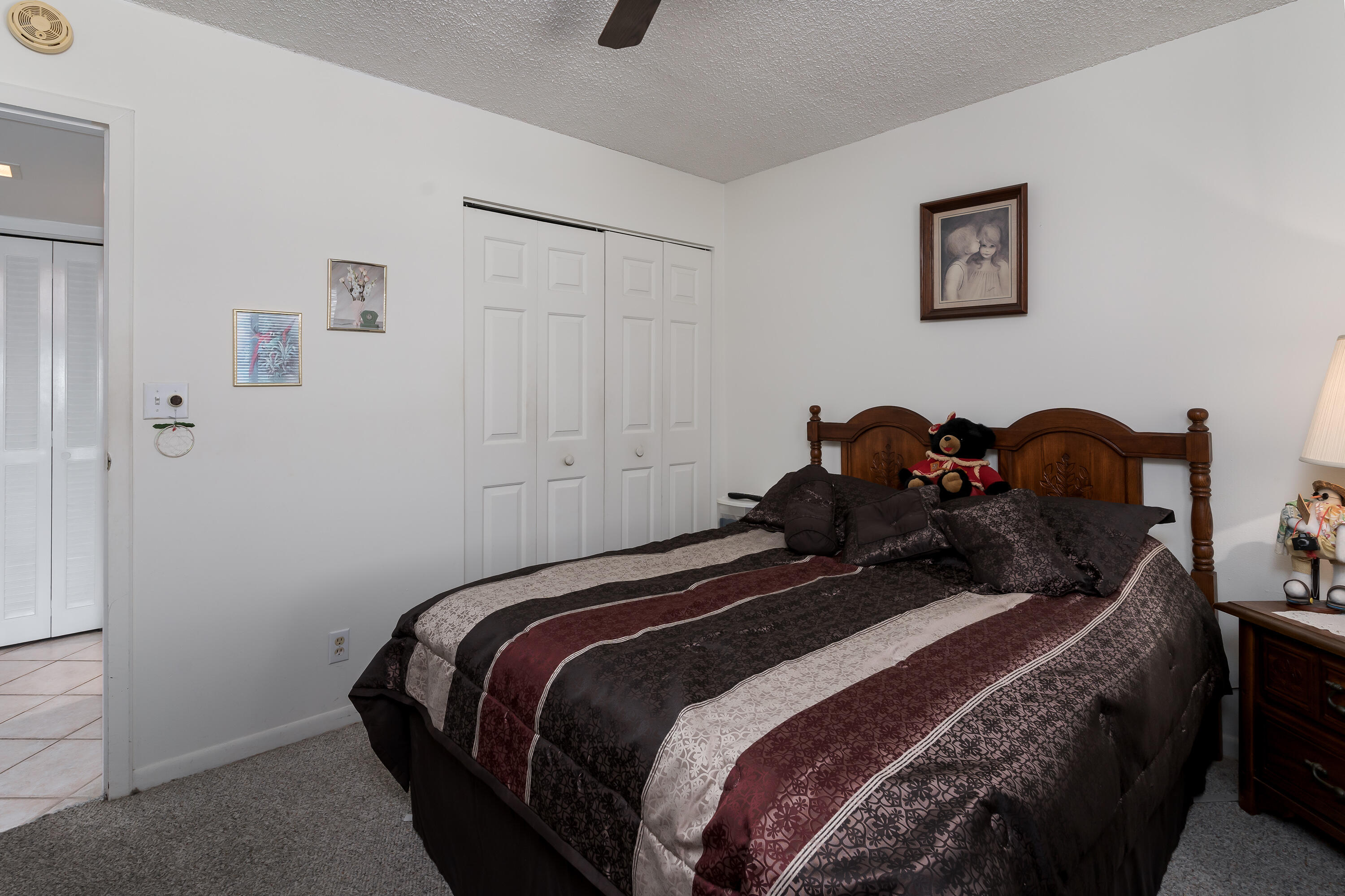 1010 Manatee Road, Unit B 305 Naples, FL 34114 - Photo 14 of 23 a bedroom with a bed and a window
