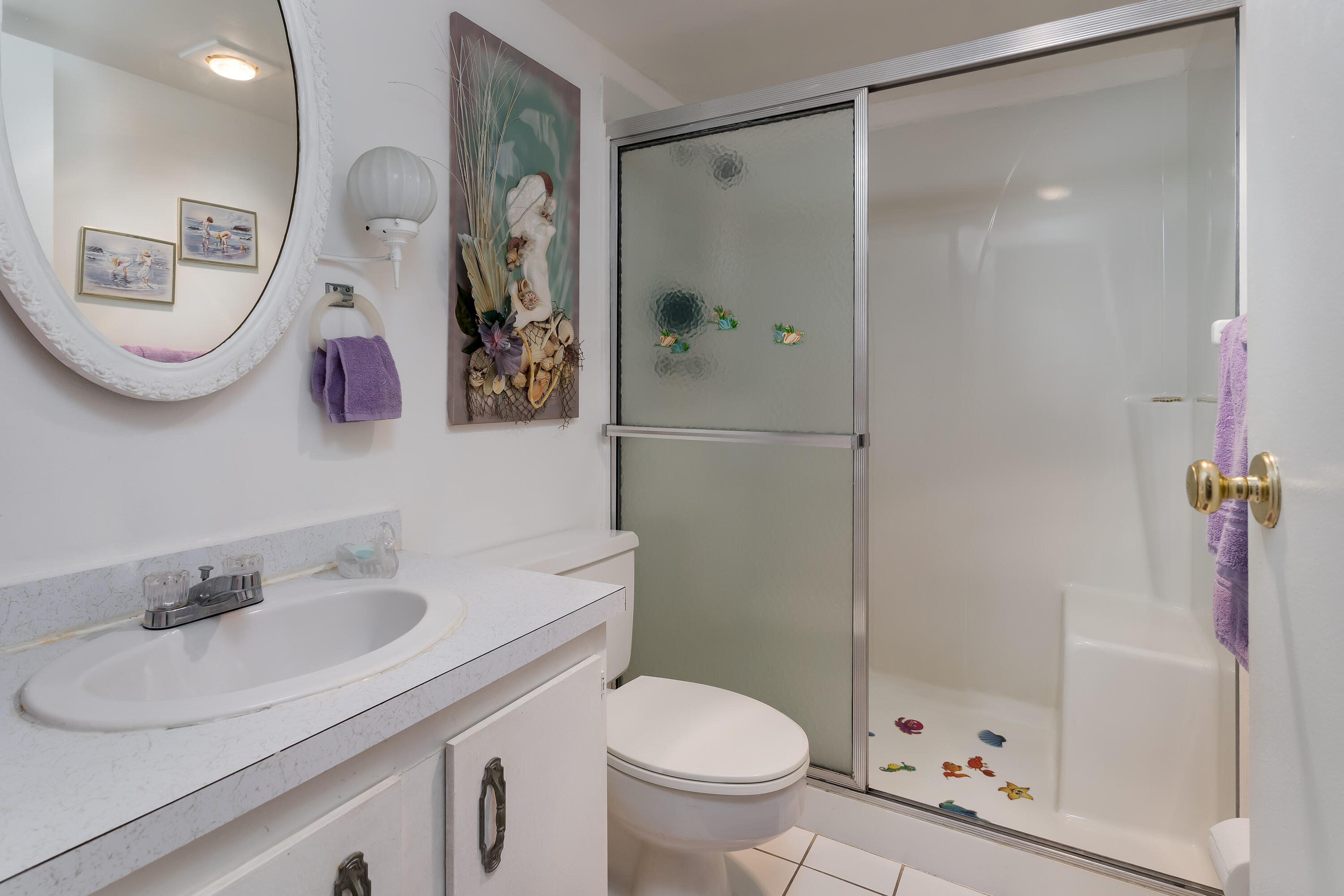 1010 Manatee Road, Unit B 305 Naples, FL 34114 - Photo 15 of 23 a bathroom with a sink toilet and shower
