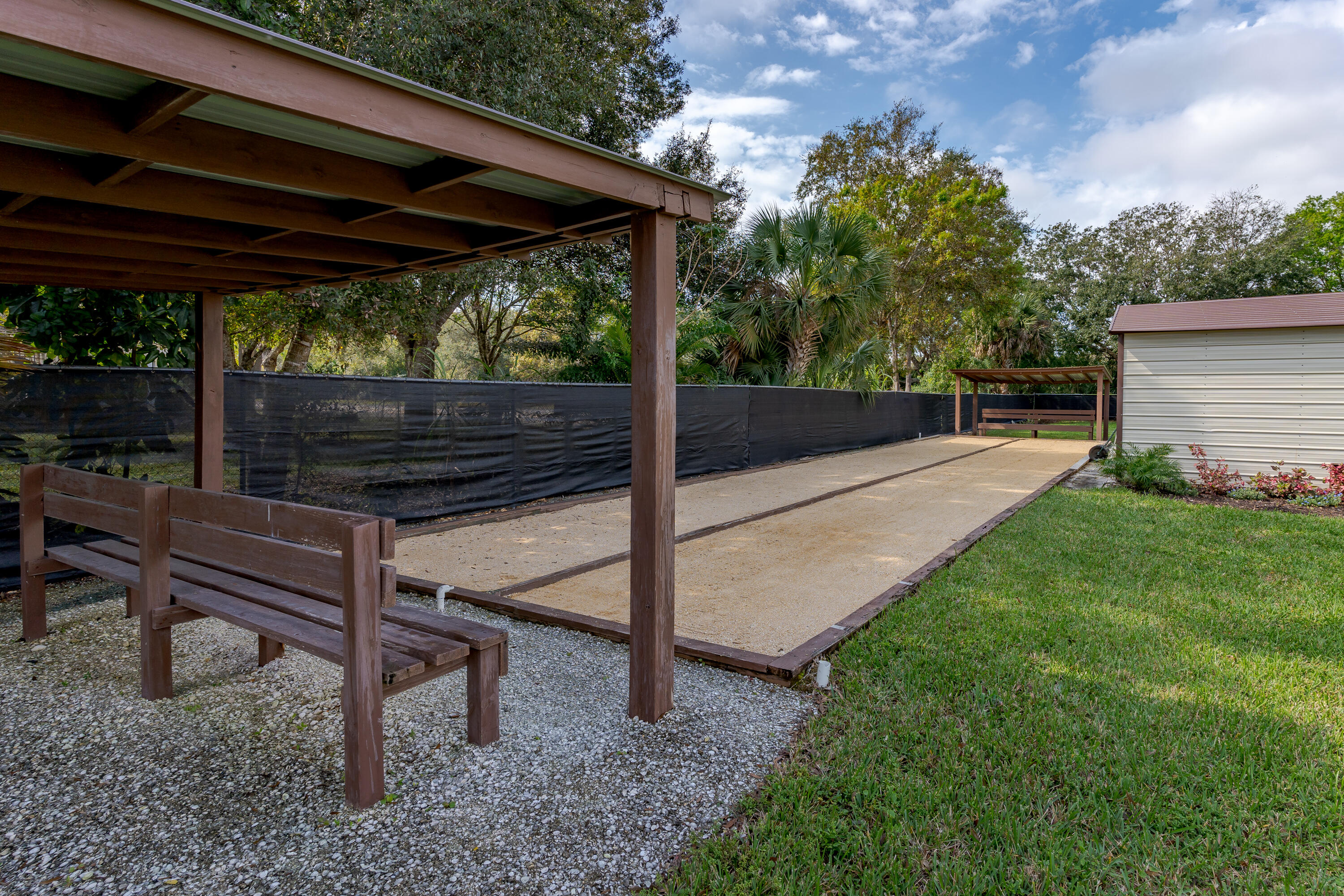1010 Manatee Road, Unit B 305 Naples, FL 34114 - Photo 22 of 23 a view of a backyard with wooden fence