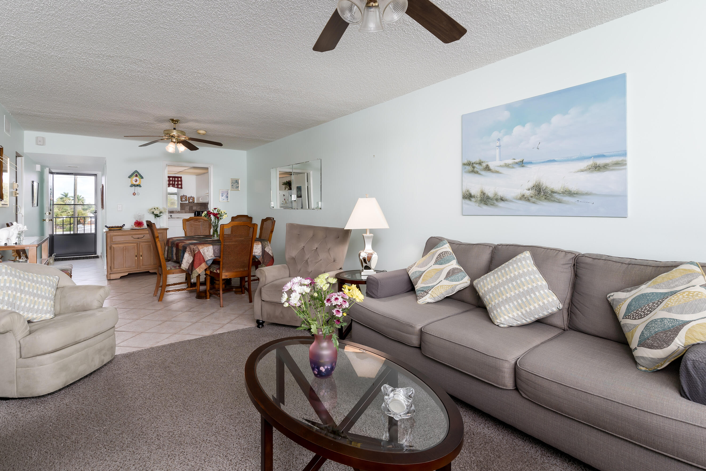 1010 Manatee Road, Unit B 305 Naples, FL 34114 - Photo 4 of 23 a living room with furniture and a chandelier