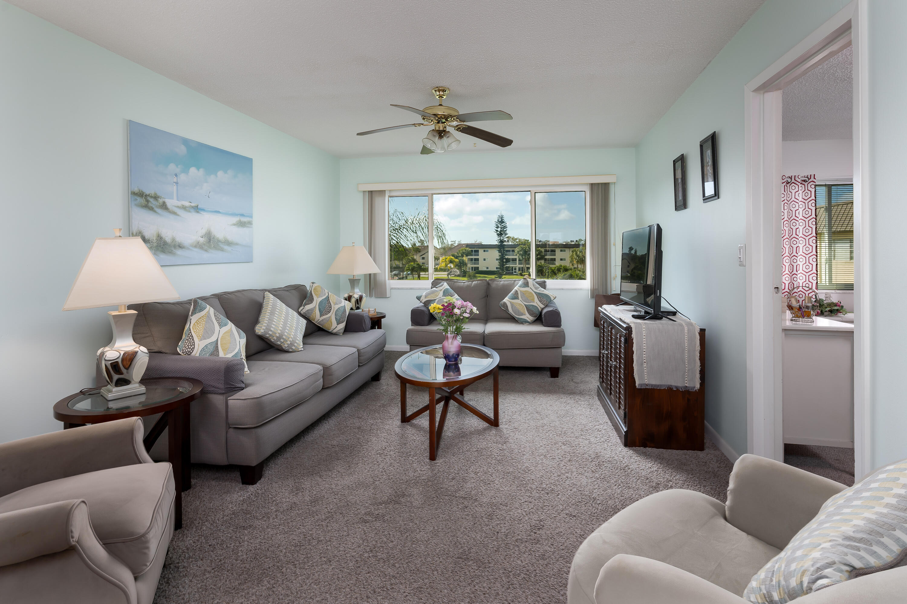 1010 Manatee Road, Unit B 305 Naples, FL 34114 - Photo 5 of 23 a living room with furniture and a large window