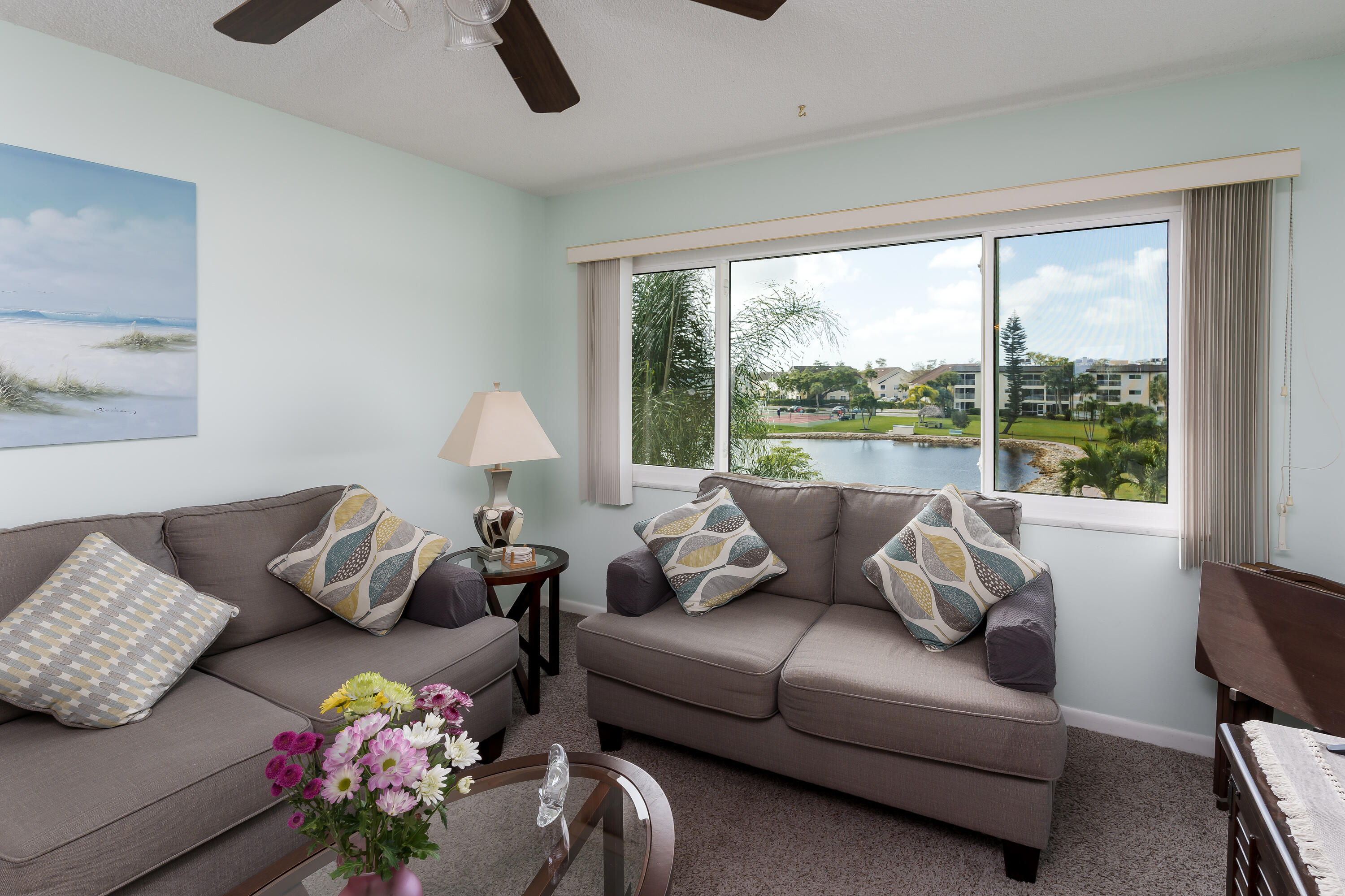 1010 Manatee Road, Unit B 305 Naples, FL 34114 - Photo 6 of 23 a living room with furniture and a large window