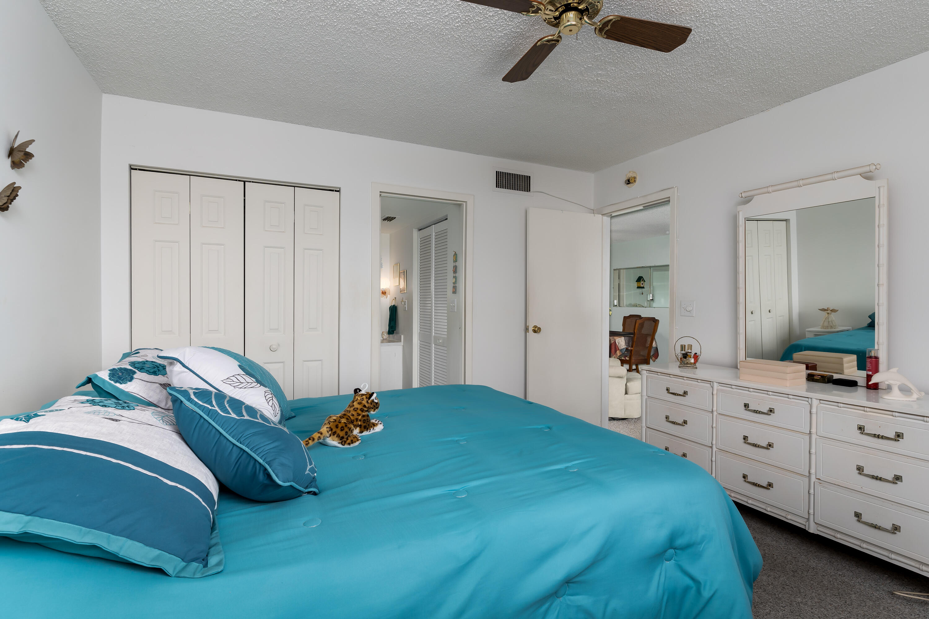 1010 Manatee Road, Unit B 305 Naples, FL 34114 - Photo 10 of 23 a bedroom with a bed and a dresser