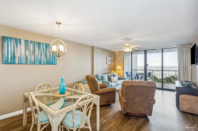 a living room with furniture a window and a dining table