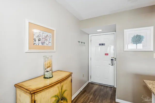 a view of hallway with wooden floor
