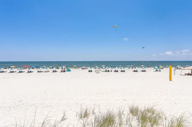 a front view of a building with a swimming pool