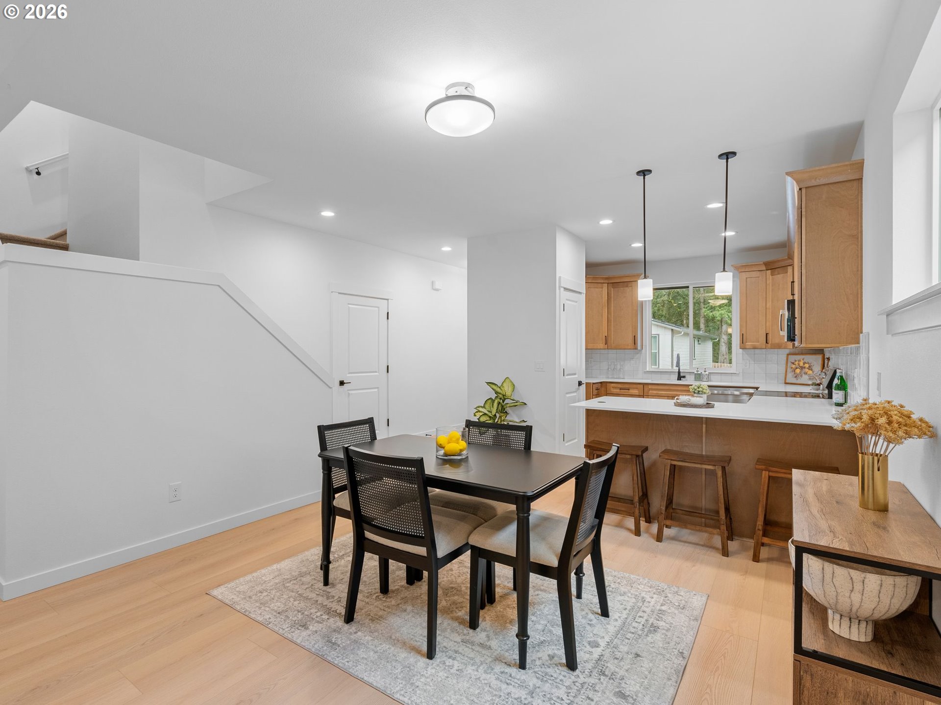 2250 Northeast 207th Place Fairview, OR 97024 - Photo 13 of 36 a dining room with a wooden table and chairs