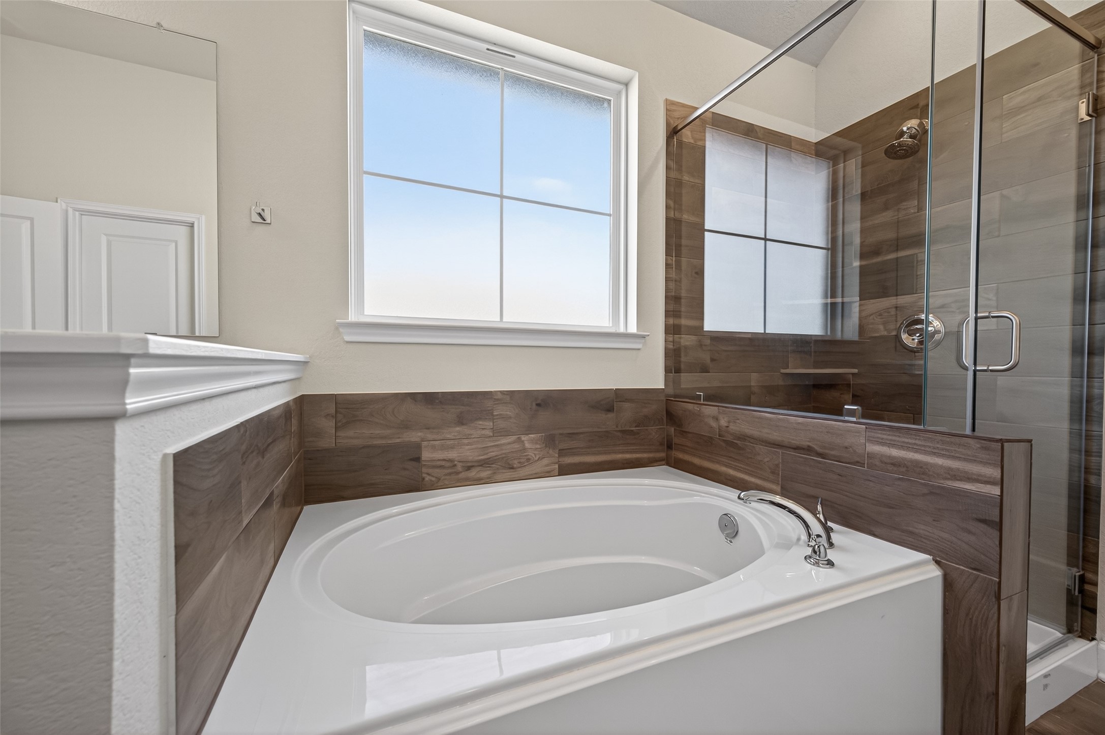 917 Farm Path Brenham, TX 77833 - Photo 24 of 43 a bathroom with a bathtub and sink