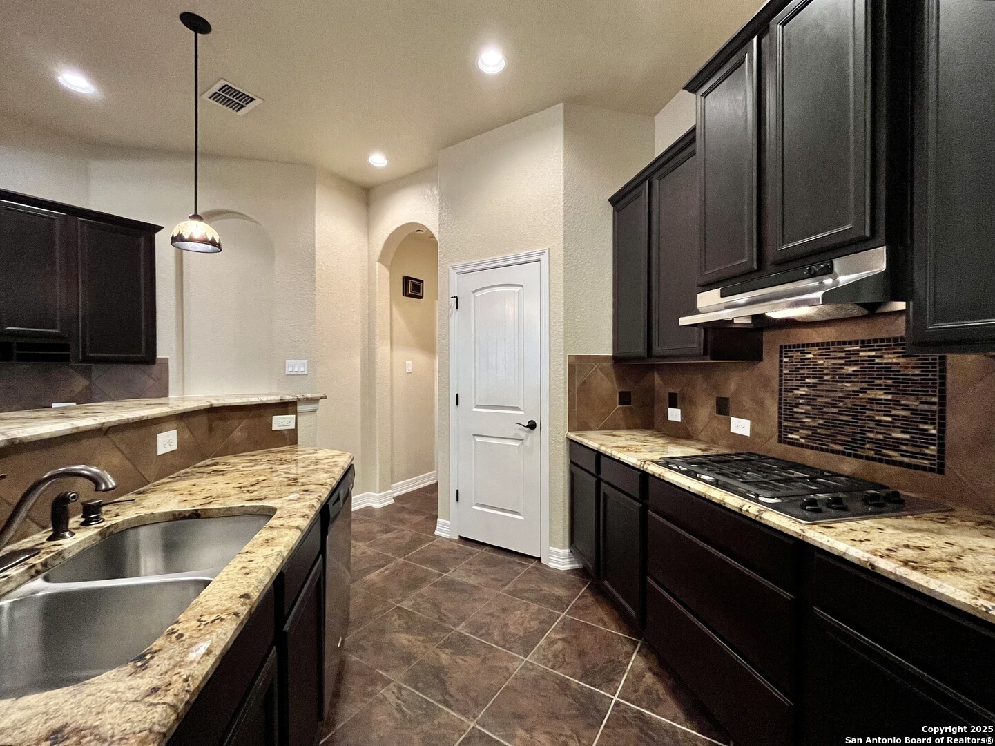 8123 Poconos Run San Antonio, TX 78255 - Photo 16 of 47 a kitchen with stainless steel appliances granite countertop a sink stove and refrigerator