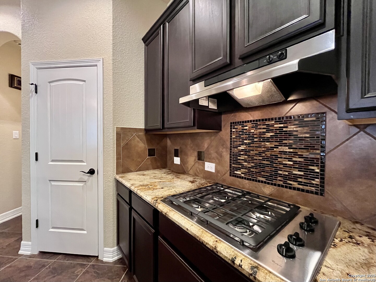8123 Poconos Run San Antonio, TX 78255 - Photo 17 of 47 a stove top oven sitting inside of a kitchen