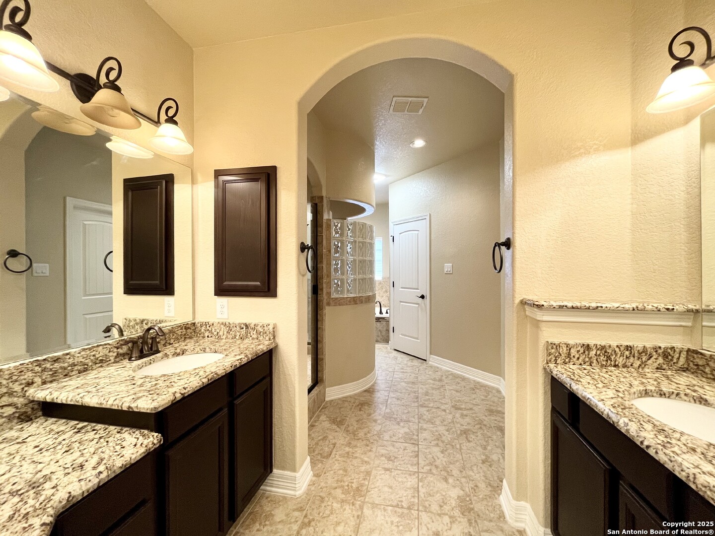 8123 Poconos Run San Antonio, TX 78255 - Photo 22 of 47 a bathroom with a granite countertop sink and a mirror
